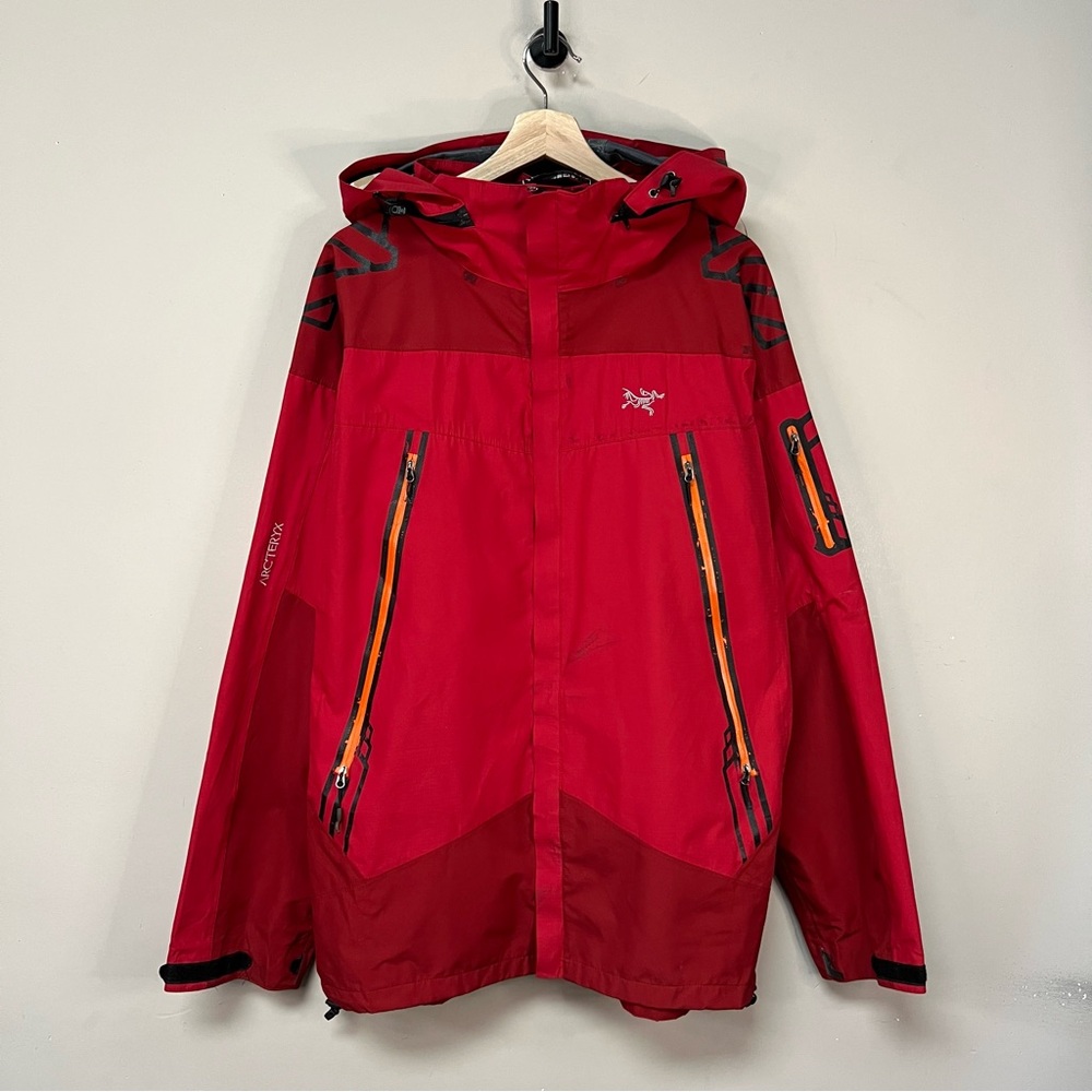 Arc'teryx Red Hooded Shell Jacket with Orange Zippers